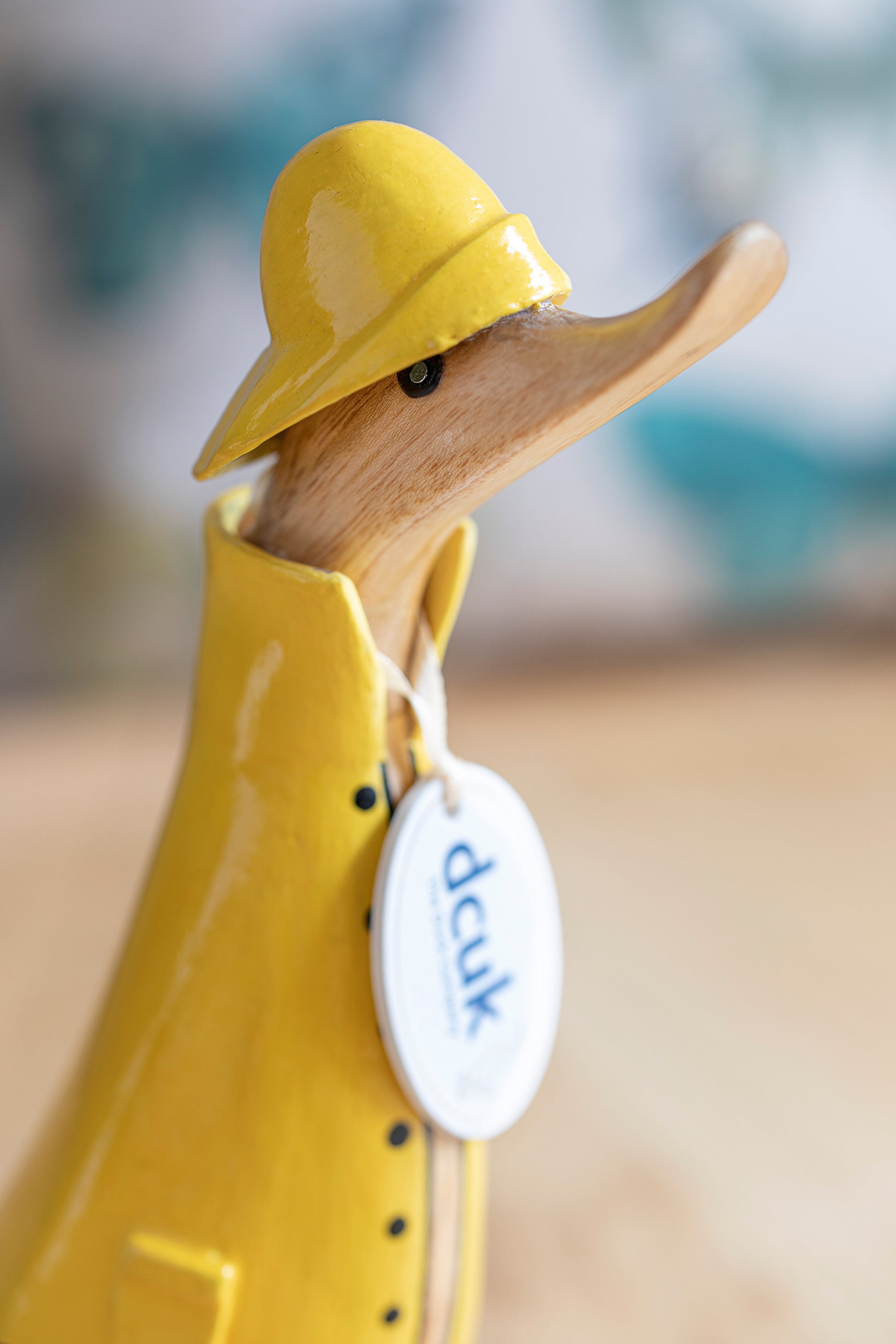 wooden duck with yellow wellies